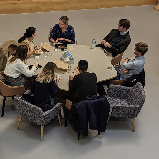 A picture of a group of people around a table
