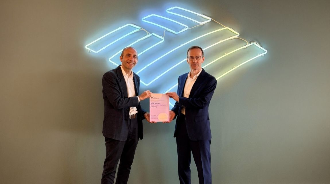 A photo of AJ McCray, Head of Global Payments Product, Bank of America (right) with Daniel Webber, CEO, FXC Intelligence